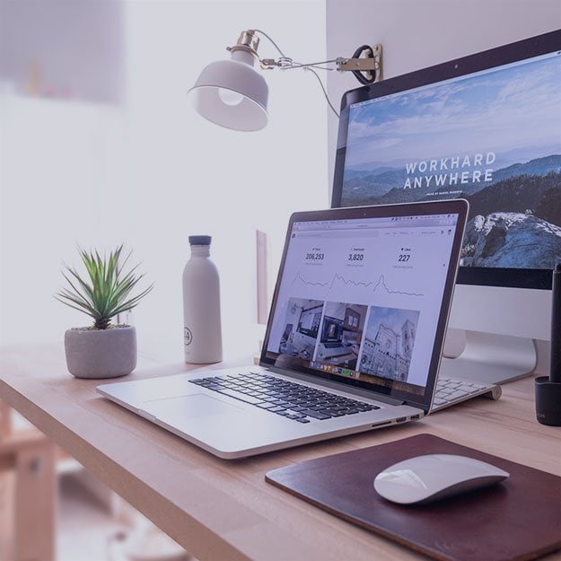Modern workspace with laptop, monitor, and office accessories for career development.
